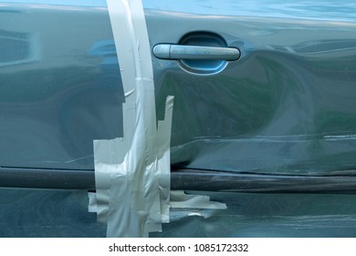 Damaged Car Door, Repaired With Duct Tape