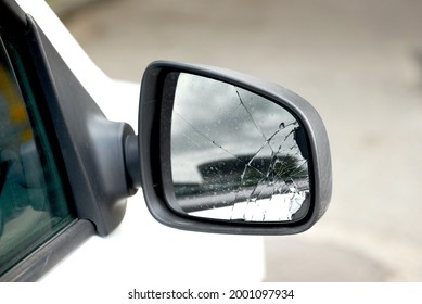 Damaged Car Side Mirror, Cracked Glass. Broken Car Wing Mirror. Bad Driving, Problems With Car. Road Accident Concept