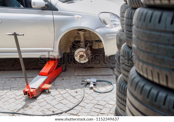 Damaged car tire\
change and repair\
equipment