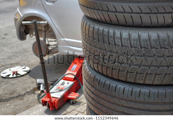 Damaged car tire\
change and repair\
equipment