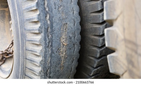 Damaged Car Tires. Close-up Of A Worn Or Torn Car Tire Of A Large Truck Tire. Selective Focus