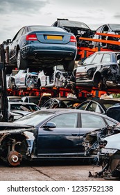 Damaged cars waiting in a scrapyard to be recycled or used for spare part - Shutterstock ID 1235752138