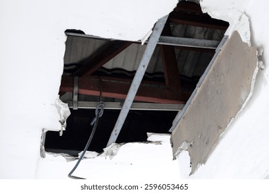 Damaged ceiling with a large hole