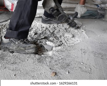 Damaged Cement Floor See Broken Steel Bars And Electric Drills Have To Repair The New Floor To Use	