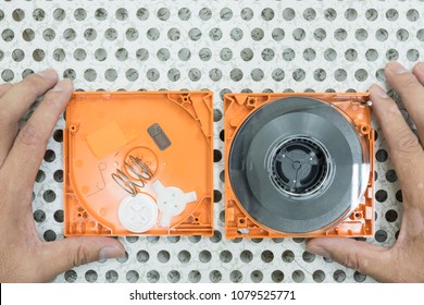 Damaged Computer Backup Tape Isolated On Raised Floor In Server Room.