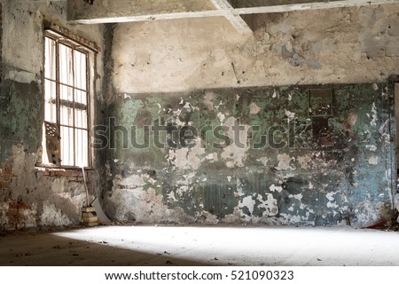 damaged, dirty room of old abandoned building