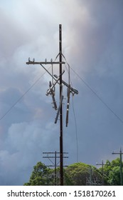 Damaged Electrical Pole With Loose Wires