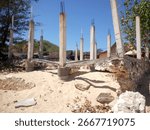Damaged frame structure of a building on the seashore due to seawater erosion.