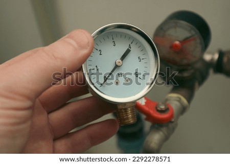 Damaged and good manometer. Plumping servise. Bad pressure gauge in the pipeline. Plumbing concept or service water worker