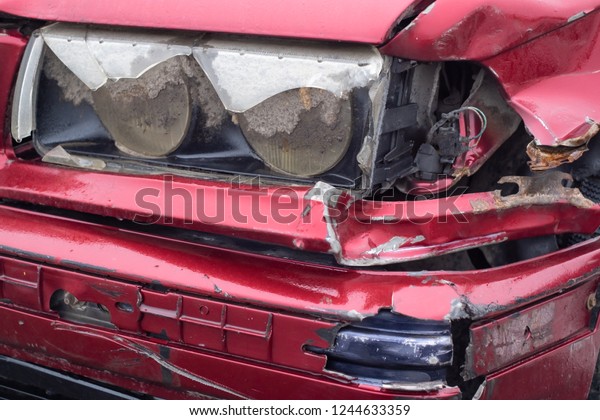 damaged head lamp and\
bumber in red car