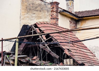 Damaged Home Roof After A Natural Disaster, Earthquake, Tsunami Or Even After War Bombing