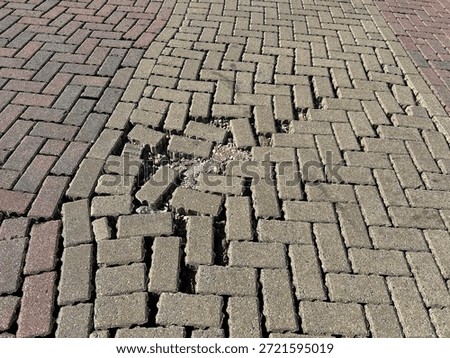 Damaged Interlocking Brick Pavers Pattern With Loose Gravel
