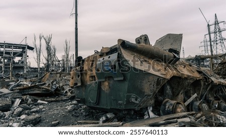 Similar – Foto Bild beschädigter Militärpanzer auf einer Straße in der Ukraine