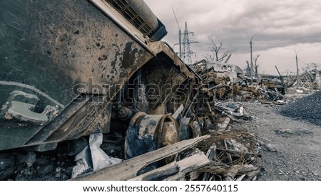 Similar – Foto Bild beschädigter Militärpanzer auf einer Straße in der Ukraine