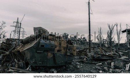 Similar – Foto Bild beschädigter Militärpanzer auf einer Straße in der Ukraine