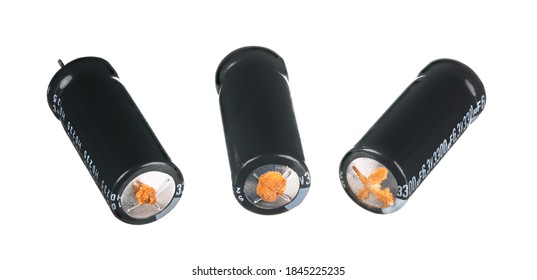 Damaged Obsolete Aluminium Electrolytic Capacitors Isolated On White Background. Three Cracked Electrical Energy Storage Devices With Leaked Liquid Electrolyte. High Equivalent Series Resistance. Eco.