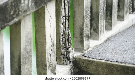 Damaged old reinforced concrete pillars, Cracked concrete surface with visible rusty reinforcement of bridge - Powered by Shutterstock