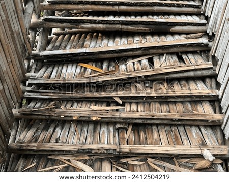 Damaged outdoor stairs made from bamboo construction which already abandoned and unsafe for pedestrians