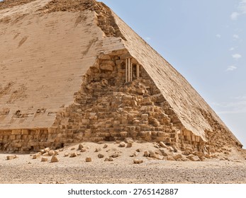 Damaged outer casing and exposed inner structure of the Bent Pyramid in Dahshur, Egypt