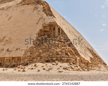 Damaged outer casing and exposed inner structure of the Bent Pyramid in Dahshur, Egypt