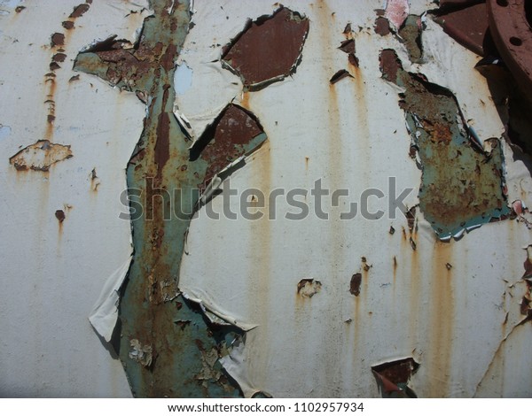 Damaged painted old wall banner, background,
texture. A grunge shabby solid background with old peeling paint.
Metal rust background, metal rust texture, rust. Decay metal
background, breakdown