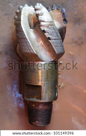Damaged PDC drilling bit on the rig floor