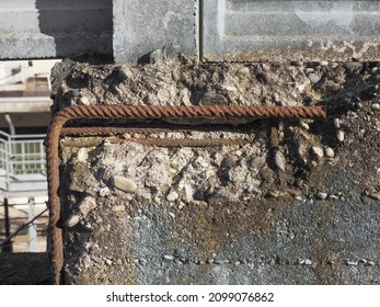damaged reinforced concrete with exposed rusted steel resistance bars industrial background