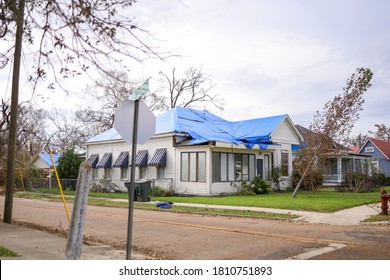 Damaged Roof With A Tarp On It