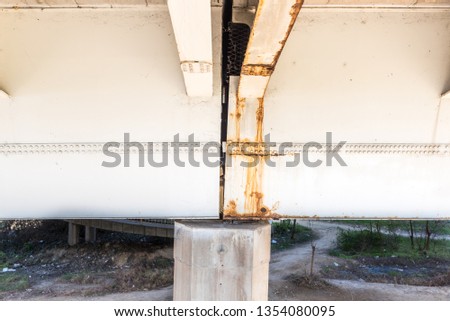 Damaged and rusted metal bridge construction with rust and corrosion on connected part with bolts danger for use in transportation