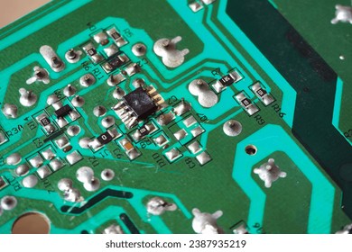 Damaged semiconductor chip on electronic circuit board.