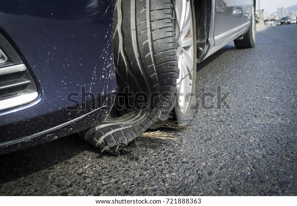 damaged tire after tire explosion at high speed\
on highway
