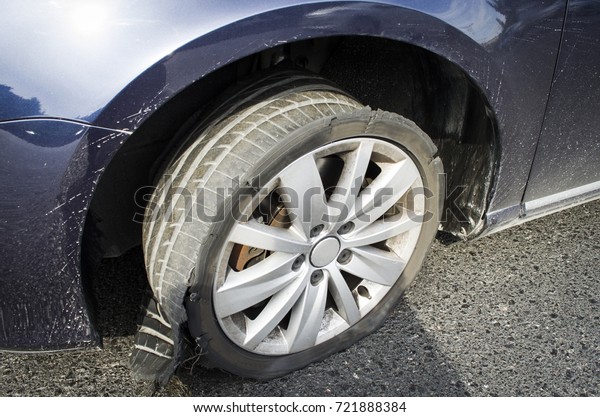 damaged tire after tire explosion at high speed
on highway