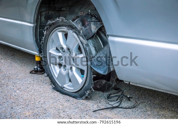 Damaged tire after tire explosion at high speed\
on highway