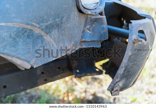Damaged, Torn off front\
bumper on car