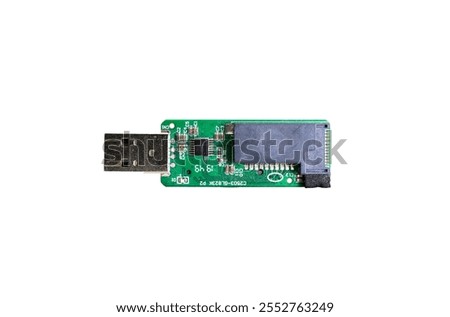  A damaged usb SD card reader without it's shell against a white background.