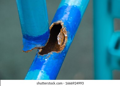 damaged water pipe, blue. A burst water pipe