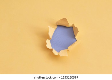 Damaged yellow paper with light blue background, space for text