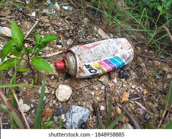 Damansara, Malaysia : November 05th, 2020 - Rusty And Crumpled Spray Paint Can Left Thrown On The Ground.