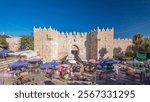 Damascus Gate or Shechem Gate timelapse hyperlapse, one of the gates to the Old City of Jerusalem, Israel. Crowd of people near entrance