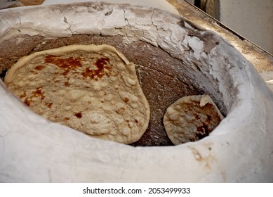 DAMASCUS, SYRIA - September 2009. Traditional Arabian Bread Baking In A Street Bakery In The Syrian Capital Of Damascus.