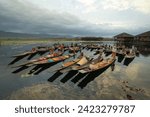 Damnoen Saduak Floating Market or Amphawa. Local people sell fruits, traditional food on boats in canal, Ratchaburi District, Thailand. Famous Asian tourist attraction destination. Festival in Asia.