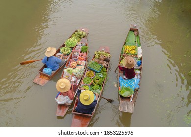 Damnoen Saduak Floating Market or Amphawa. Local people sell fruits, traditional food on boats in canal,  