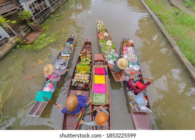Damnoen Saduak Floating Market or Amphawa. Local people sell fruits, traditional food on boats in canal,  