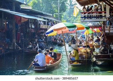 Damnoen Saduak Floating Market, tourists visiting by boat, located in Bangkok, Thailand. - Shutterstock ID 389485657