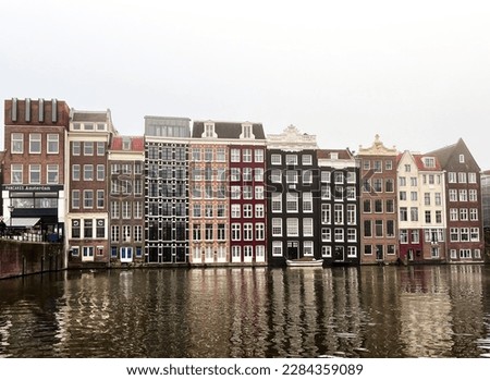 Similar – Image, Stock Photo Tranquil Amsterdam canal with iconic narrow houses