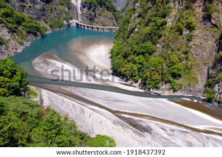 Dams and silt between valleys