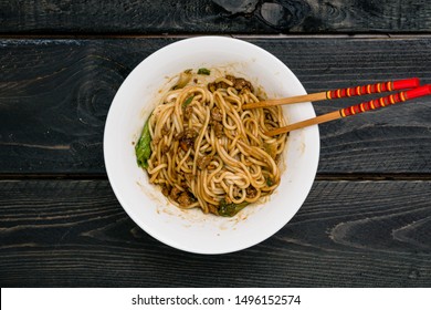 Dan Dan Chinese Noodles. Dan Dan Noodles is a spicy Szechuan cuisine dish commonly found in chinese street food. Ingredients include thick rice noodles, sichuan pepper, chili oil and ground pork.