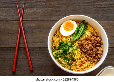 Dan dan, or tan tan noodles are a noodle dish originating from Chinese Sichuan cuisine. It consists of wheat noodles in spicy soup topped with seasoned  ground pork.