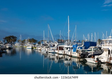 Dana Point, CA / USA - June 20 2018: View of yachts docked in Dana Point harbor on a summer morning - Shutterstock ID 1156167499