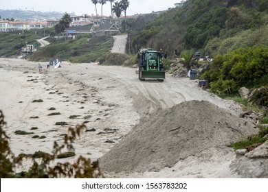 Dana Point, California, US - August 6, 2019
Tractor Doing Beach Cleanup After Storm 